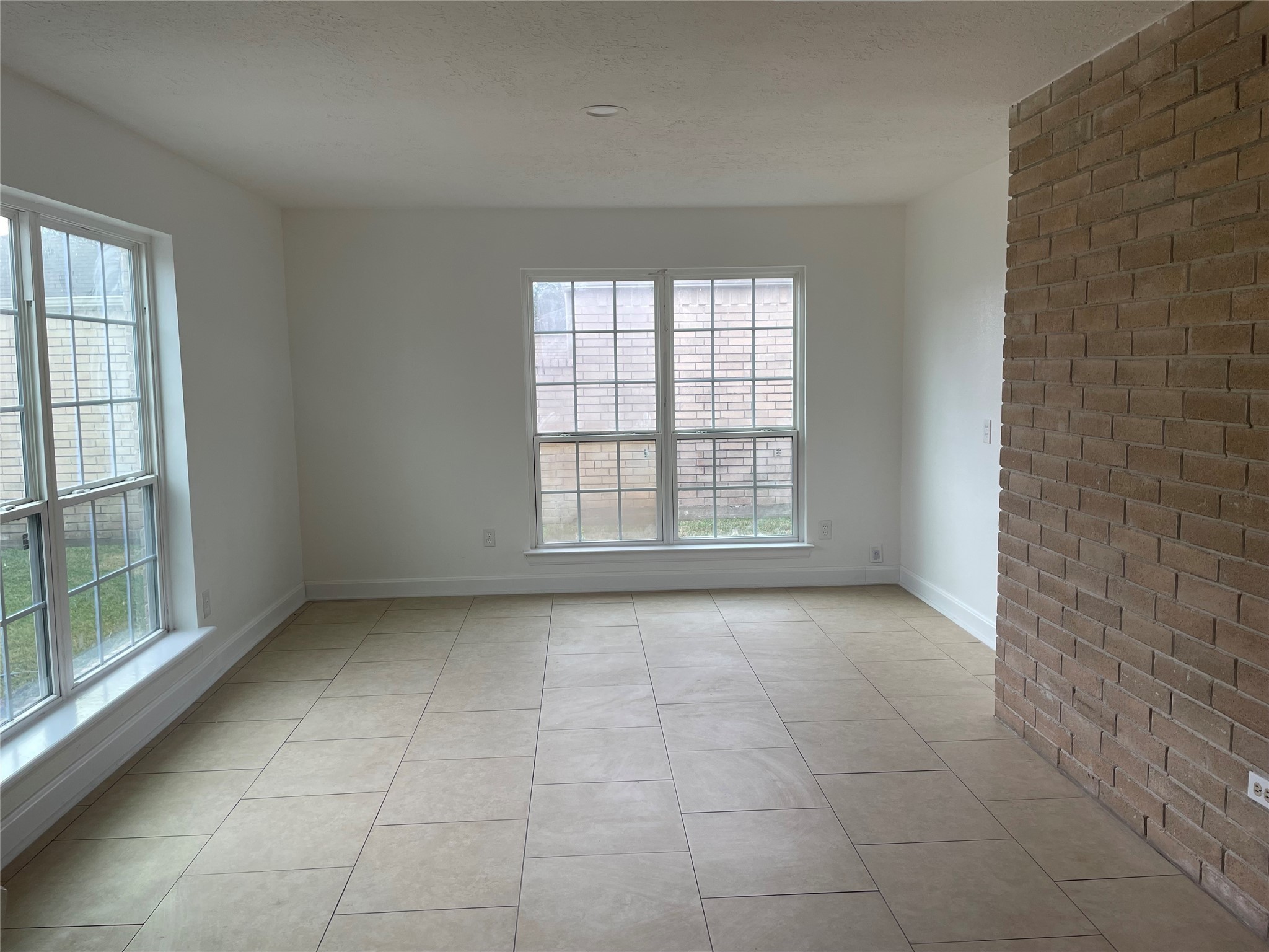 11630 Coachfield Lane Houston, TX 77035 - Photo 7 of 18 a view of an empty room with a window