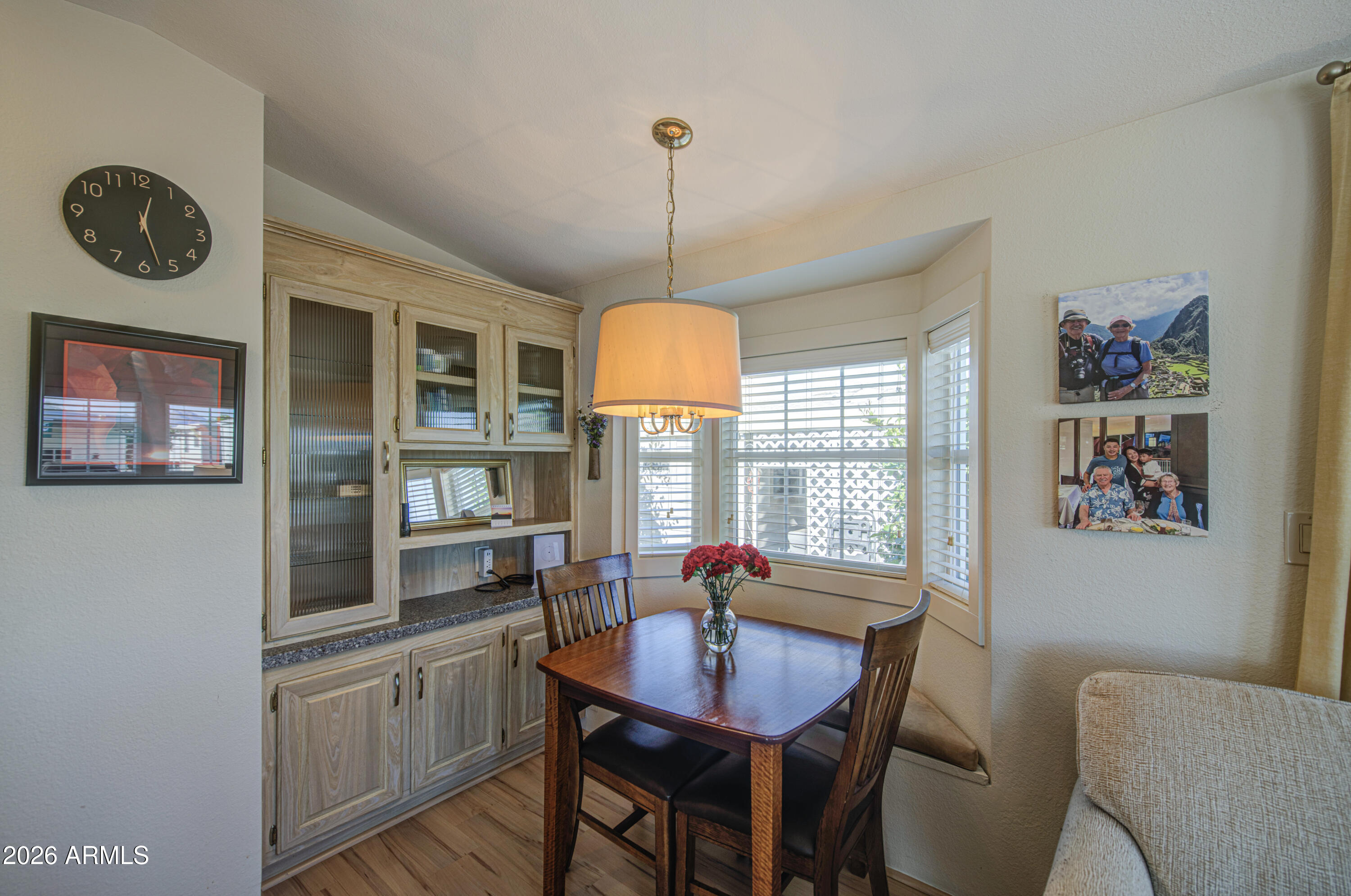7750 East Broadway Road, Unit 314 Mesa, AZ 85208 - Photo 12 of 32 a dining room with furniture a rug and a chandelier
