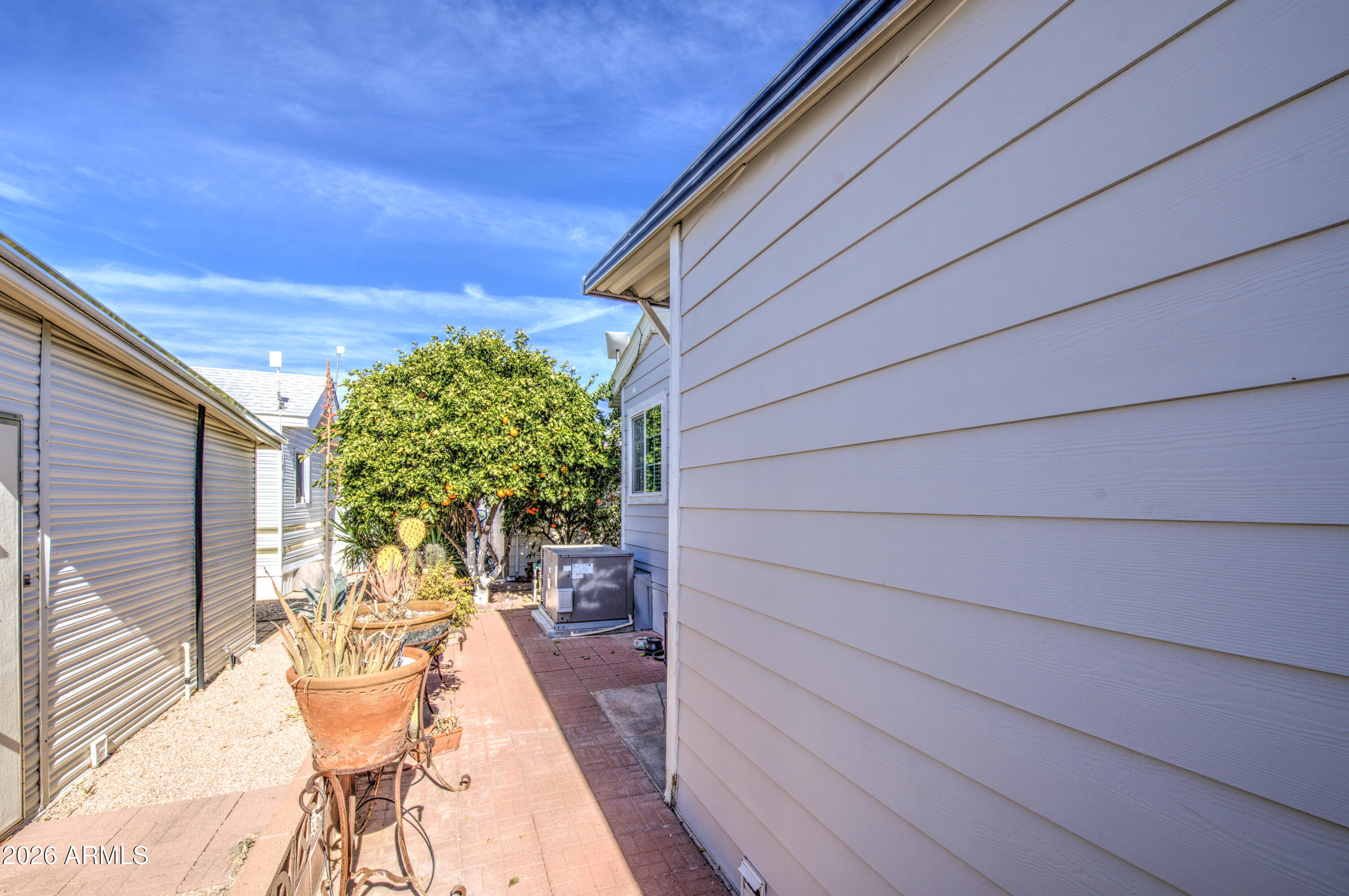 7750 East Broadway Road, Unit 314 Mesa, AZ 85208 - Photo 19 of 32 a backyard of a house with outdoor seating