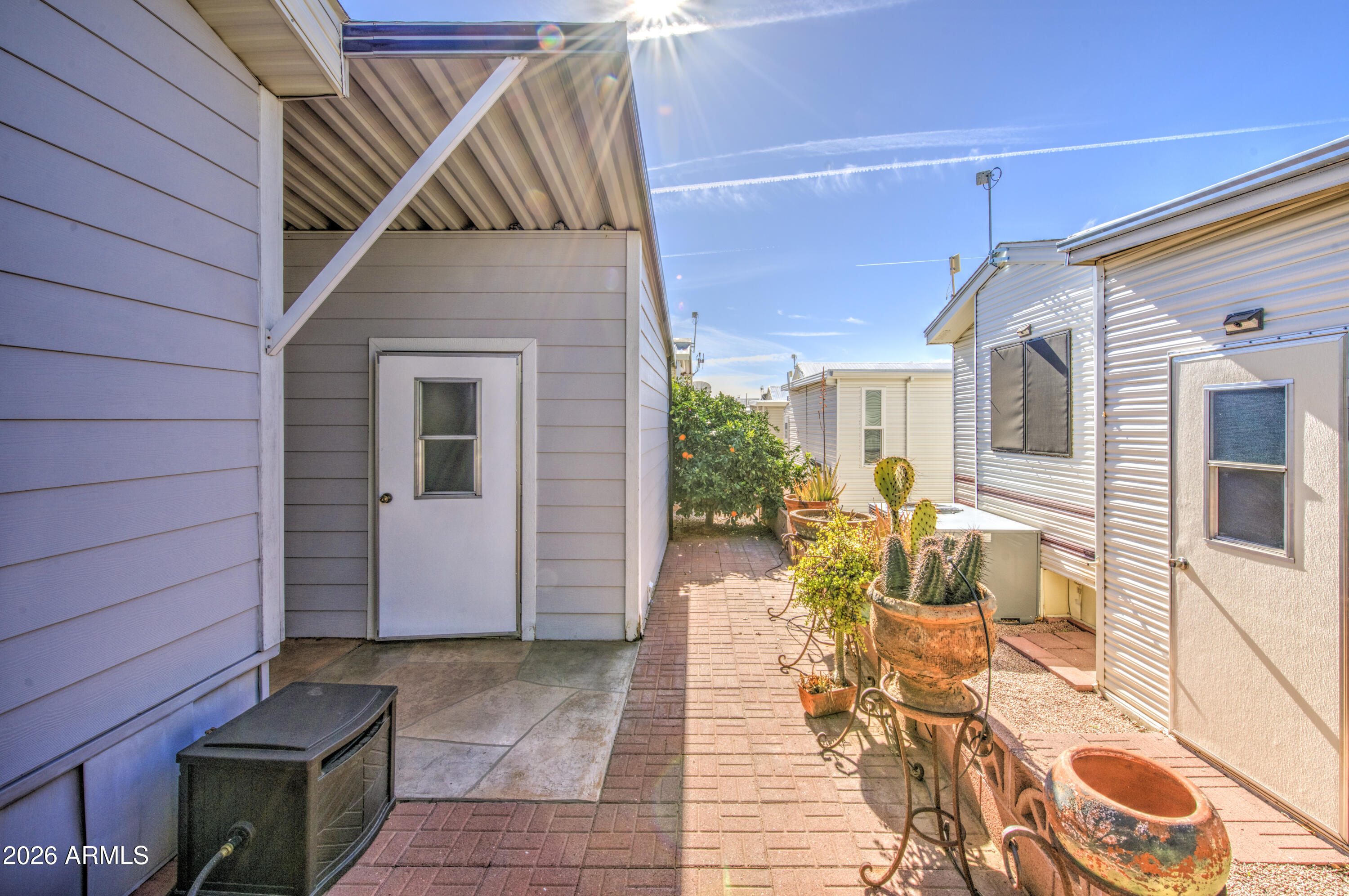 7750 East Broadway Road, Unit 314 Mesa, AZ 85208 - Photo 20 of 32 a view of a house with a patio