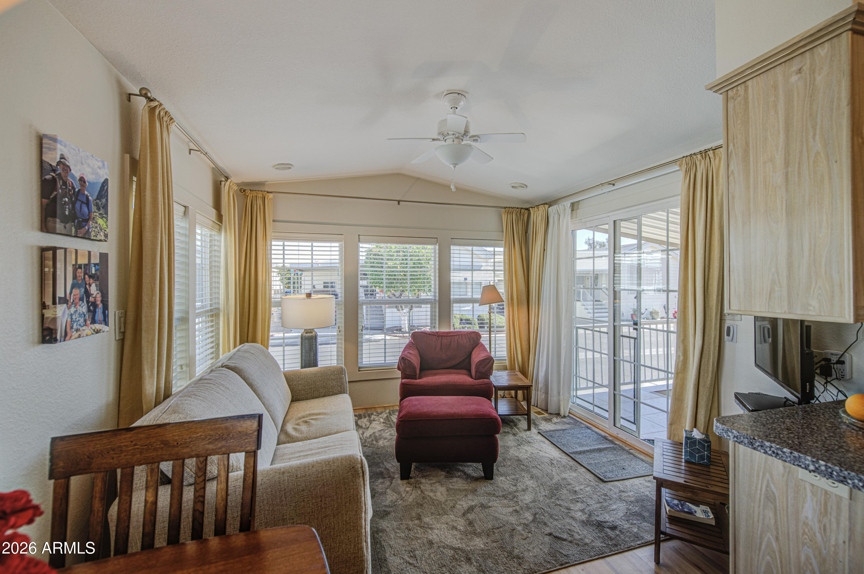 7750 East Broadway Road, Unit 314 Mesa, AZ 85208 - Photo 3 of 32 a living room with furniture and a flat screen tv