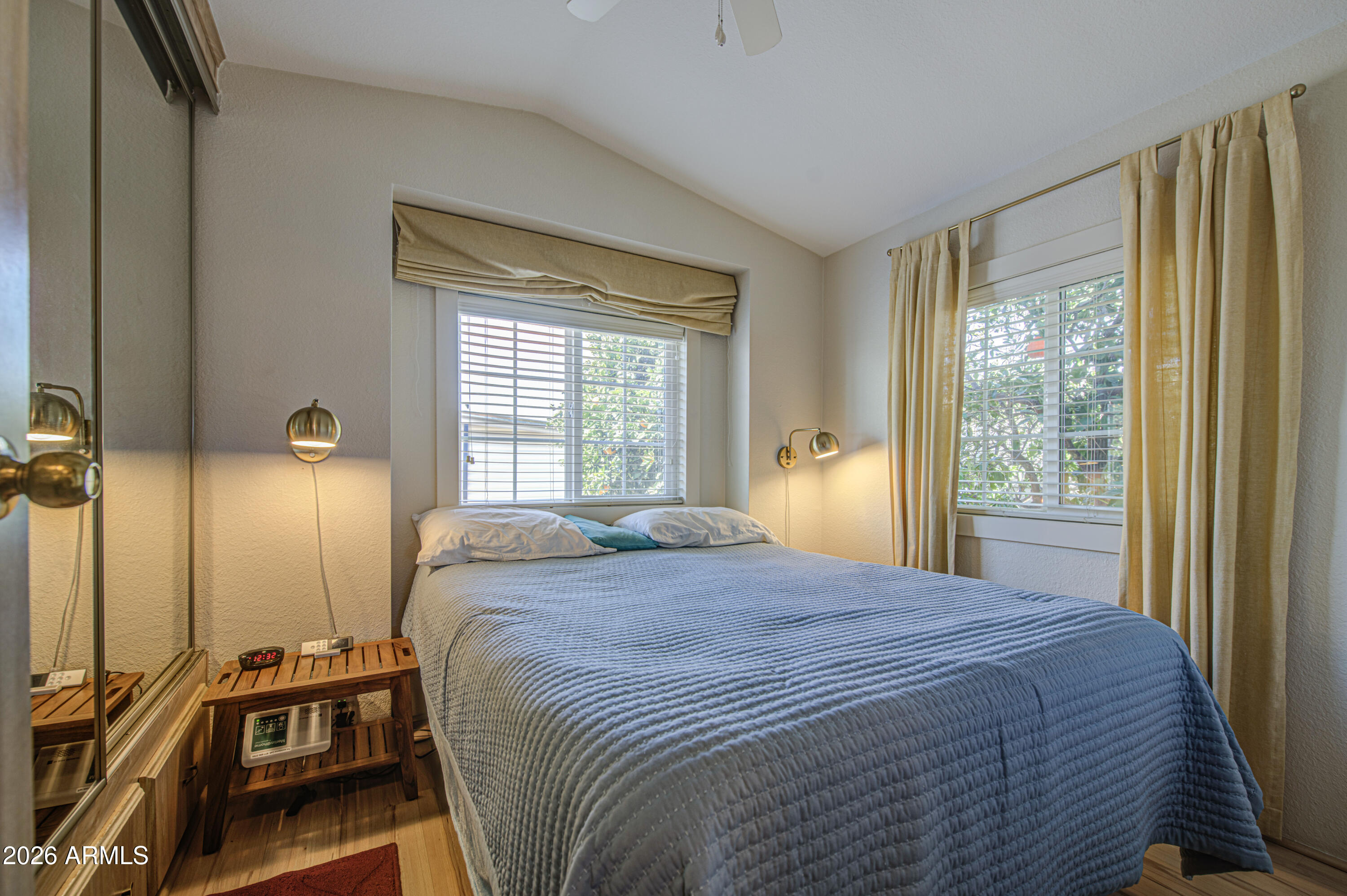 7750 East Broadway Road, Unit 314 Mesa, AZ 85208 - Photo 4 of 32 a bedroom with a bed and a large window