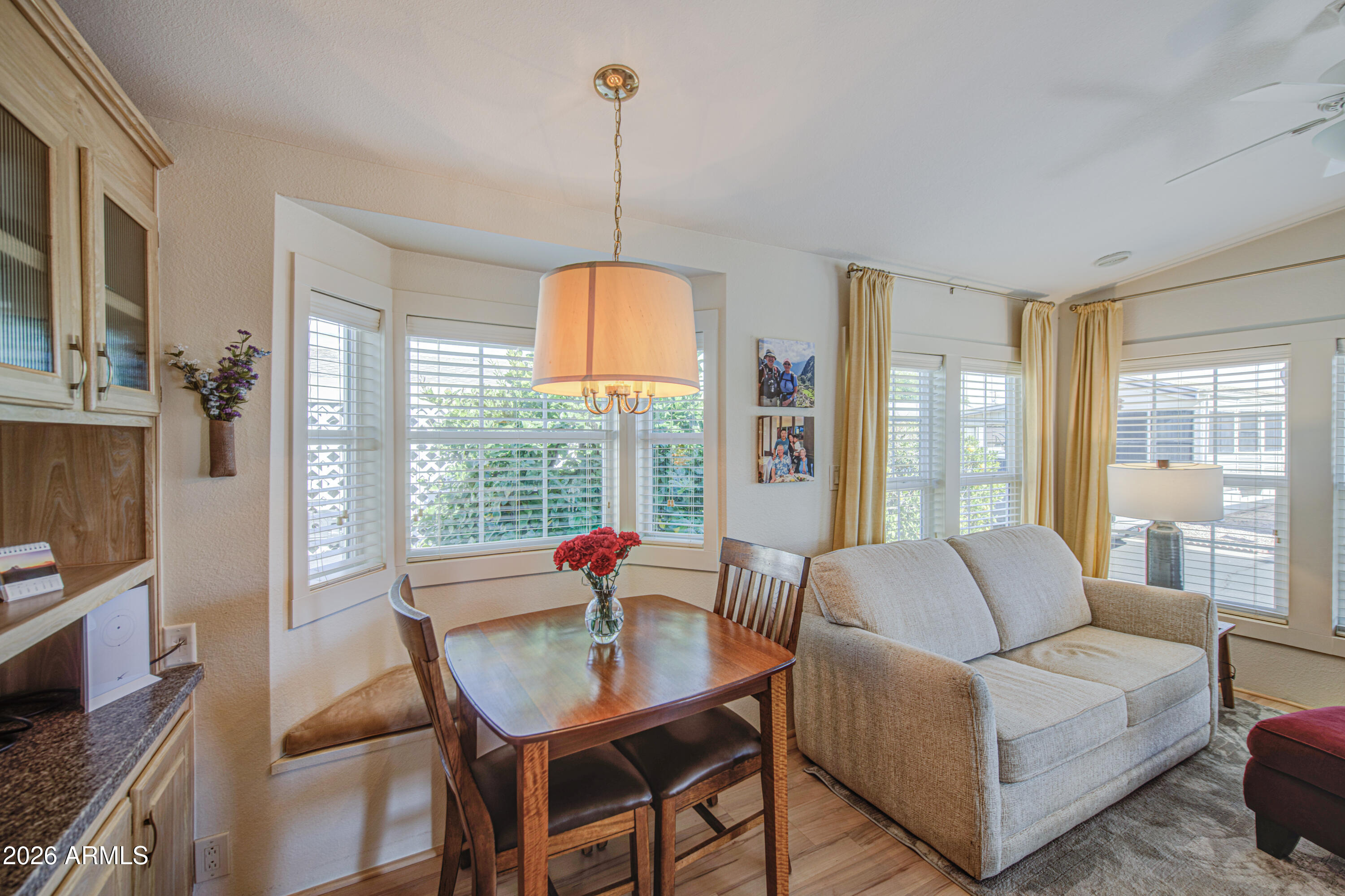 7750 East Broadway Road, Unit 314 Mesa, AZ 85208 - Photo 9 of 32 a living room with furniture and a table