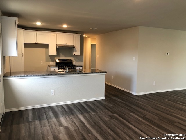 9015 Little Hoss Converse, TX 78109 - Photo 3 of 17 a view of kitchen with wooden floor