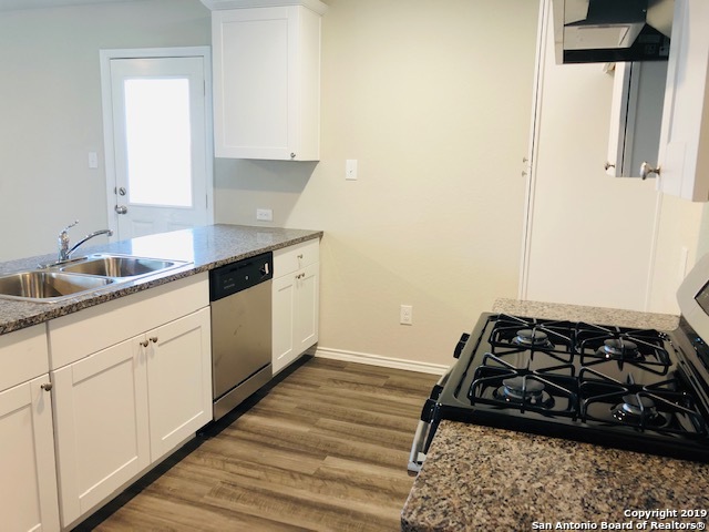 9015 Little Hoss Converse, TX 78109 - Photo 7 of 17 a kitchen with sink window and stove