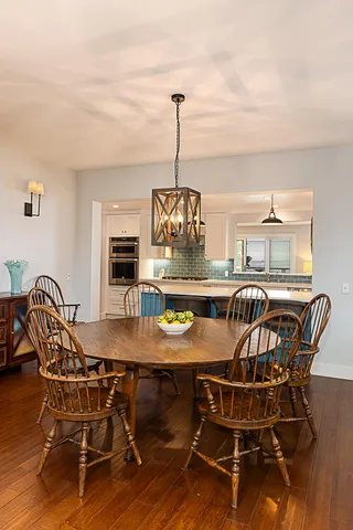 a view of a dining room with furniture window and wooden floor