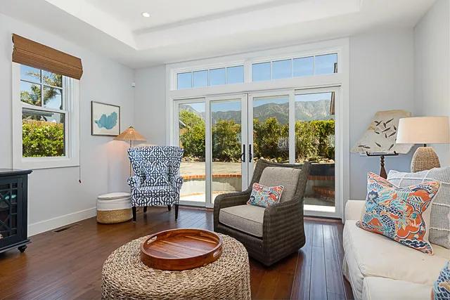 a living room with furniture and a rug