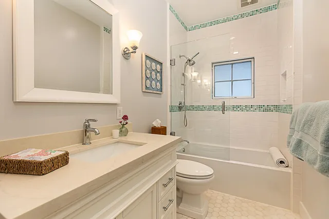 a bathroom with a sink a toilet and a bathtub