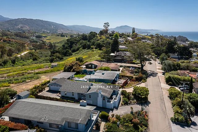 an aerial view of a house with a garden