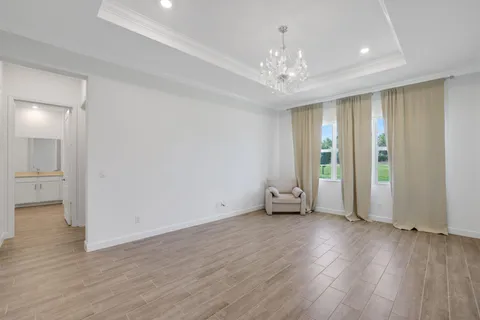 a bedroom with a bed and a desk