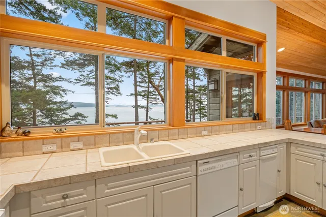 a view of a sink and large window
