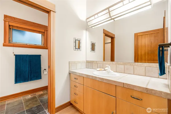 a bathroom with a sink and a mirror