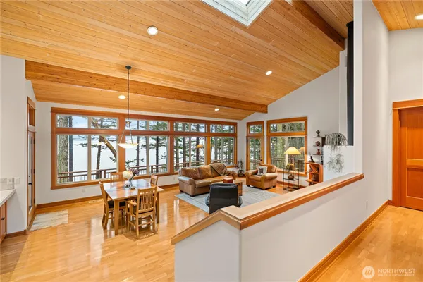 a view of a dining room with furniture wooden floor and chandelier