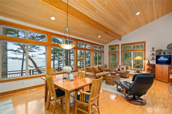 a living room with furniture city view and large windows