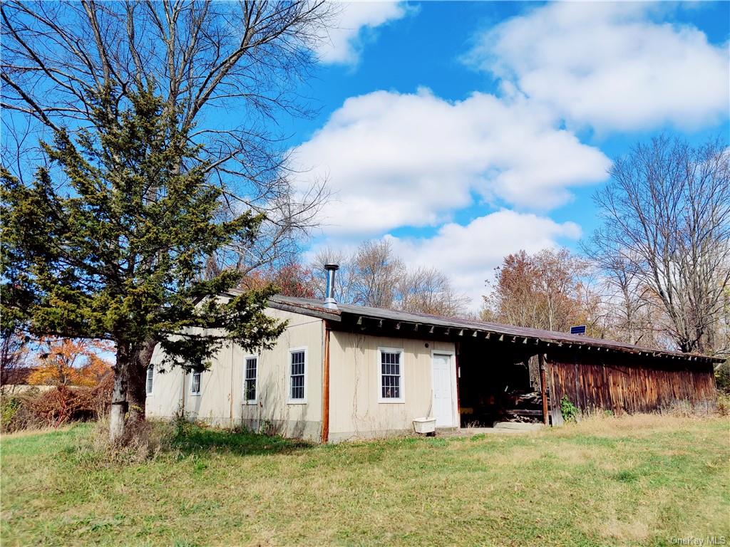 352 352 Schneider Road Hudson, NY 12541 - Photo 25 of 25 Back of property featuring a lawn