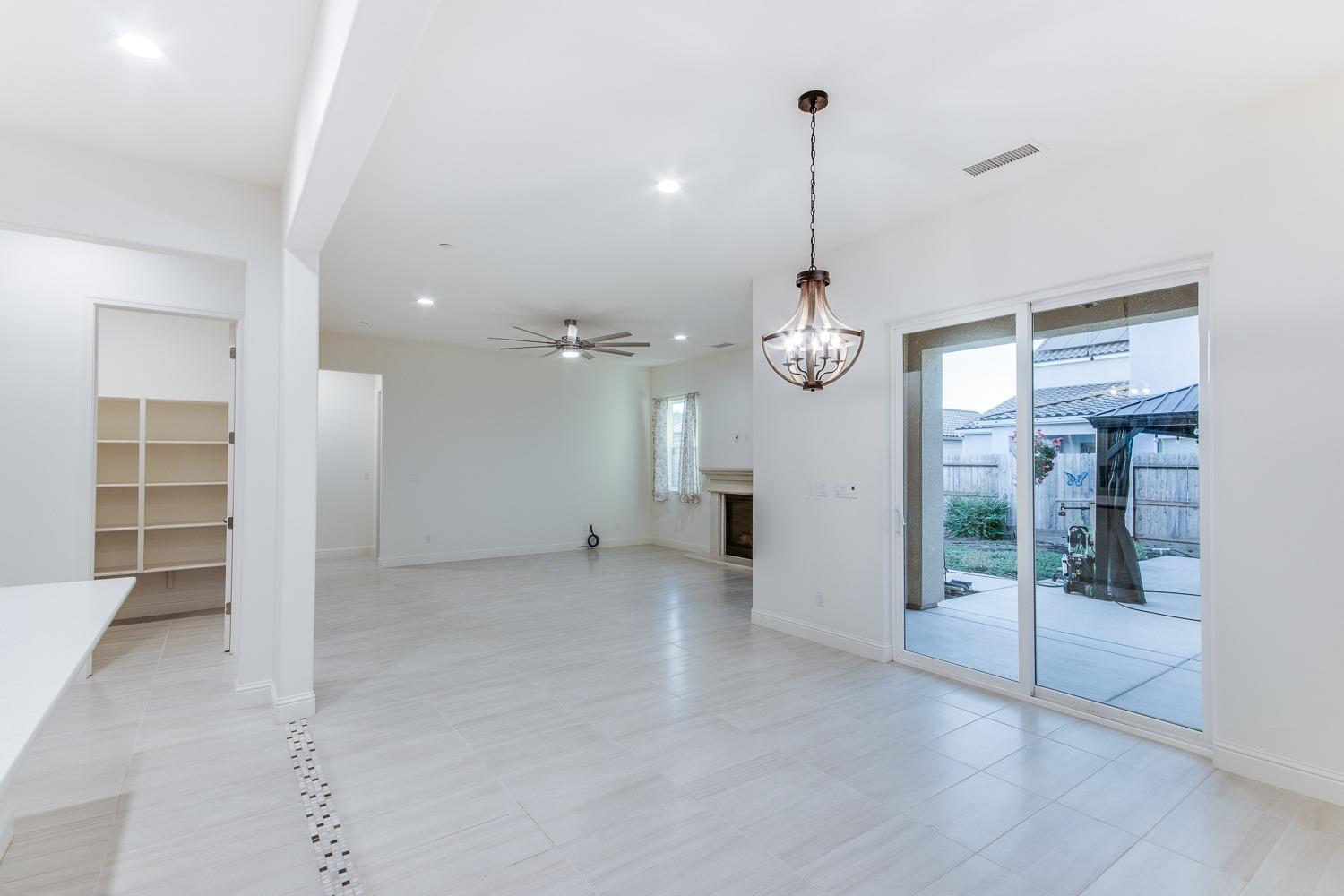 3027 Twain Avenue Clovis, CA 93619 - Photo 14 of 32 a view of a room with wooden floor and window