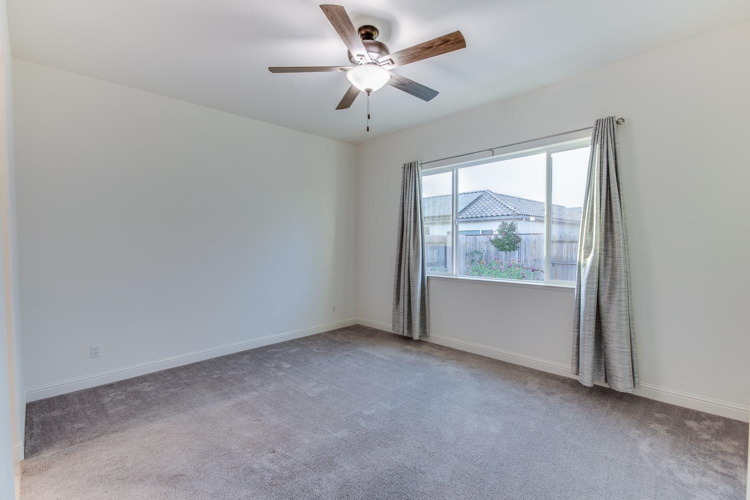 3027 Twain Avenue Clovis, CA 93619 - Photo 19 of 32 an empty room with a window