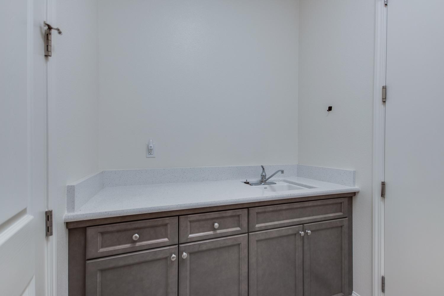 3027 Twain Avenue Clovis, CA 93619 - Photo 26 of 32 a view with cabinets and sink