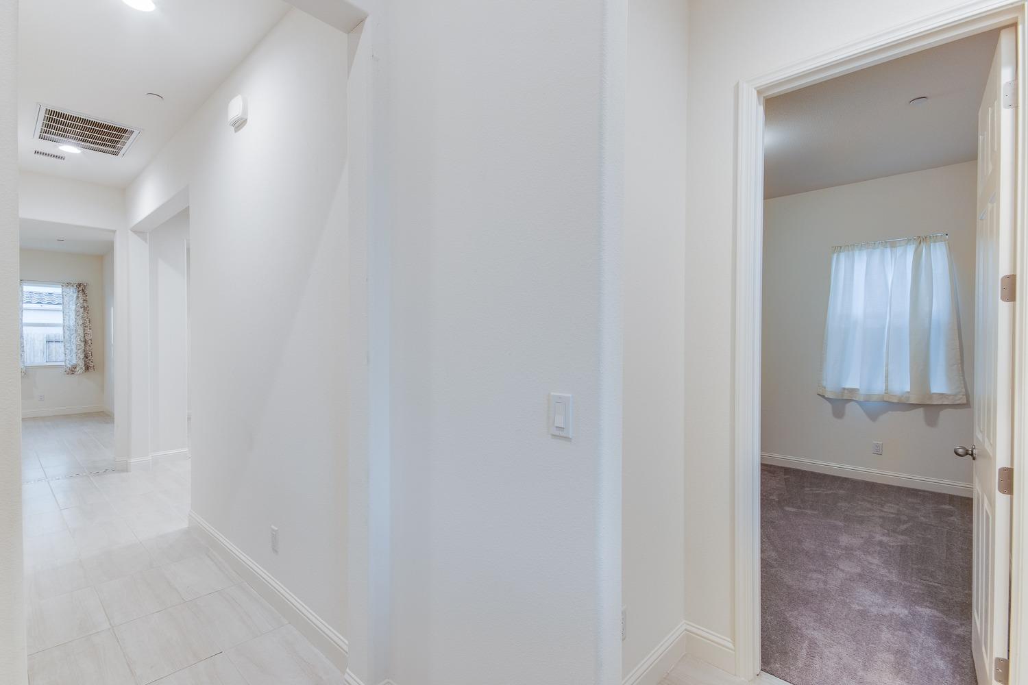 3027 Twain Avenue Clovis, CA 93619 - Photo 4 of 32 a view of a hallway
