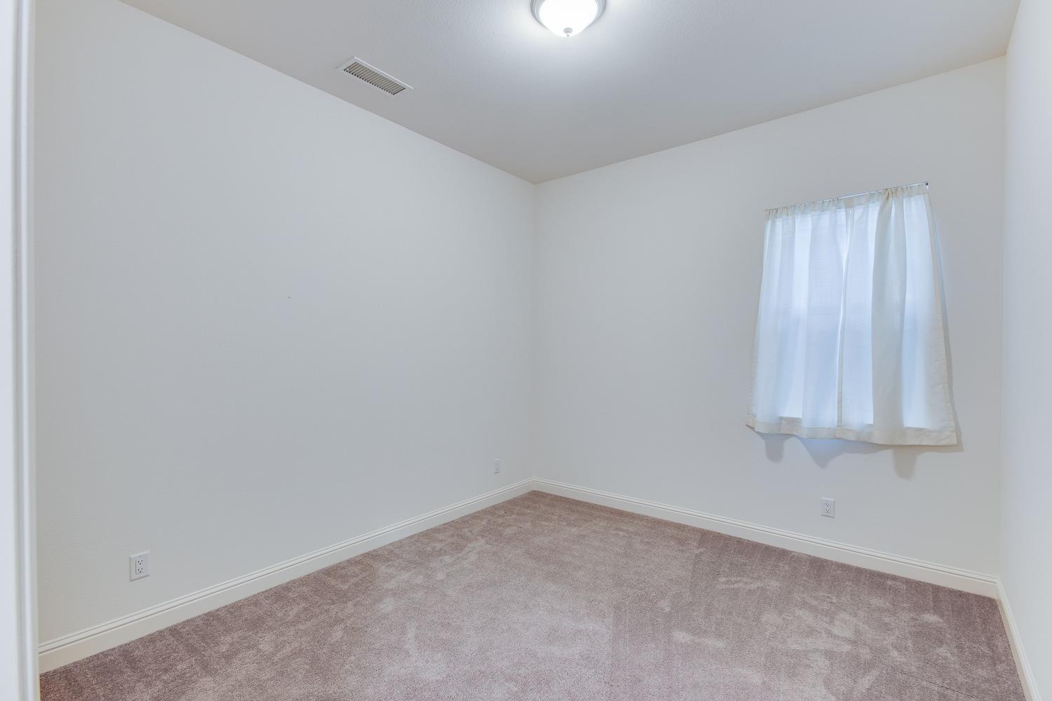 3027 Twain Avenue Clovis, CA 93619 - Photo 5 of 32 an empty room with window