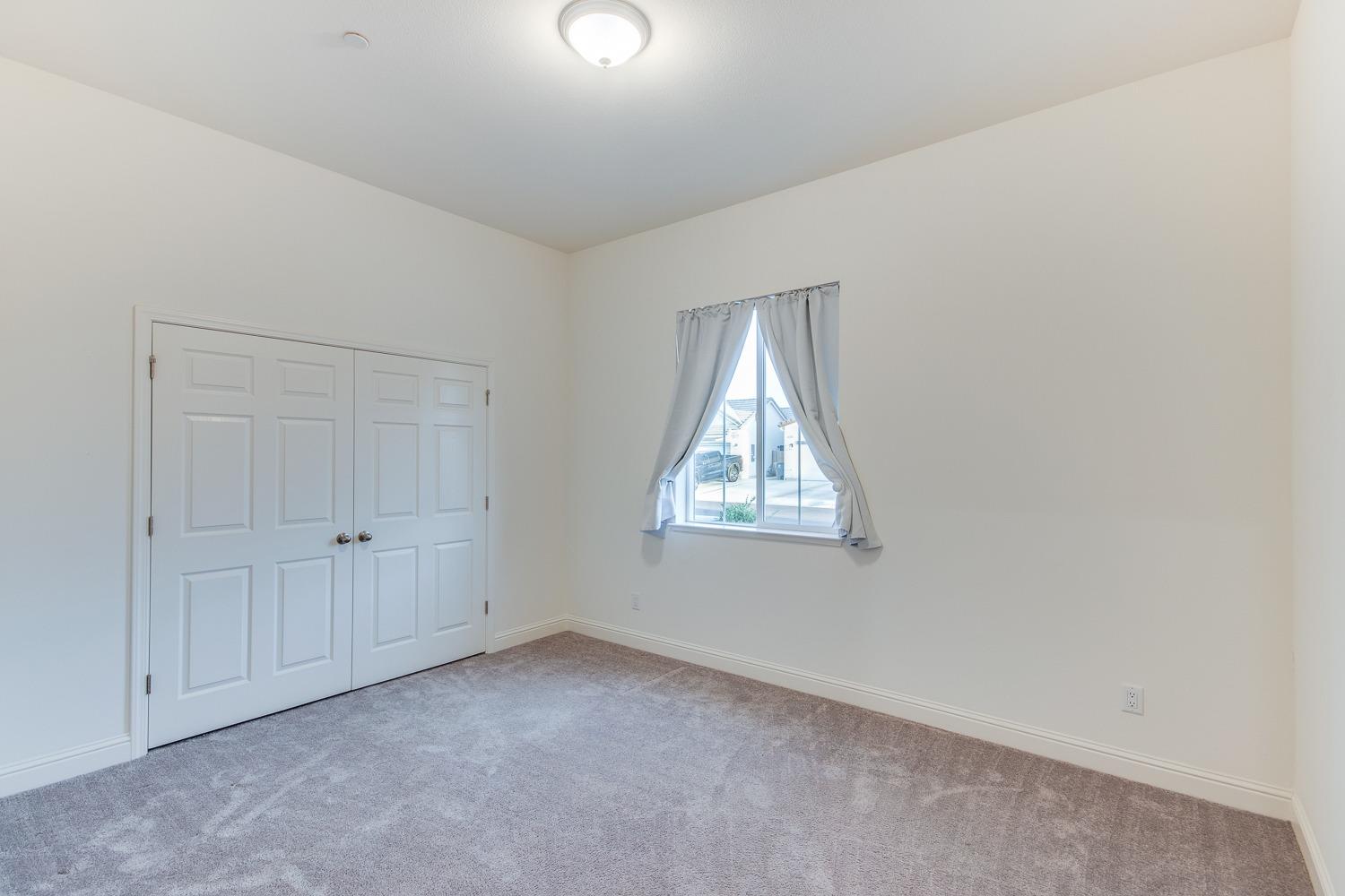 3027 Twain Avenue Clovis, CA 93619 - Photo 7 of 32 an empty room with windows