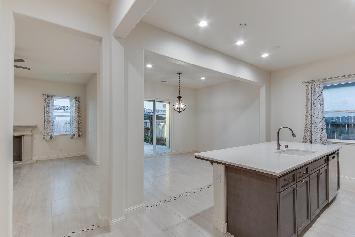 3027 Twain Avenue Clovis, CA 93619 - Photo 10 of 32 a kitchen with a sink and stove