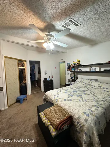 a view of a patio with couches chairs and wooden floor