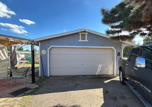 a hotel room with large bed and a couch