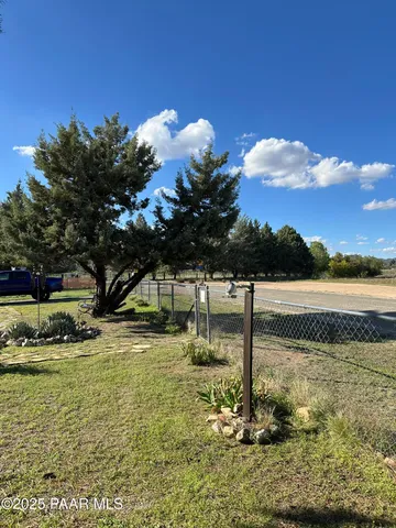 a kitchen with a refrigerator and a stove