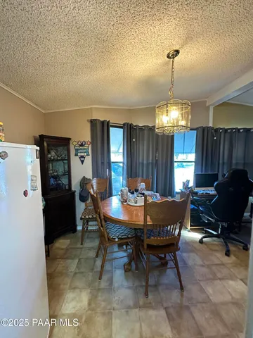 a bedroom with a bed and a table