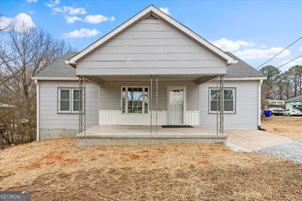 a front view of a house with a porch