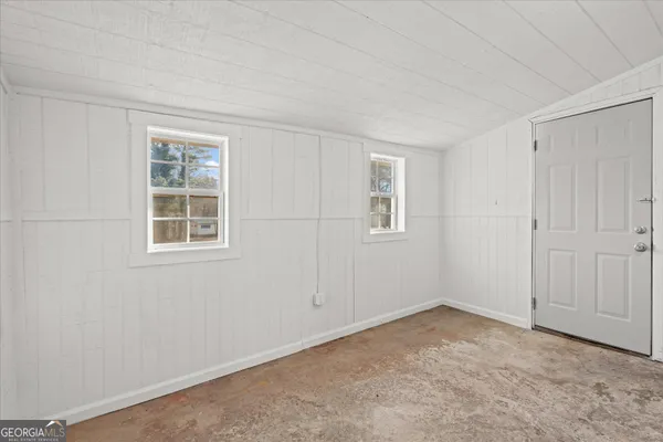 an empty room with windows