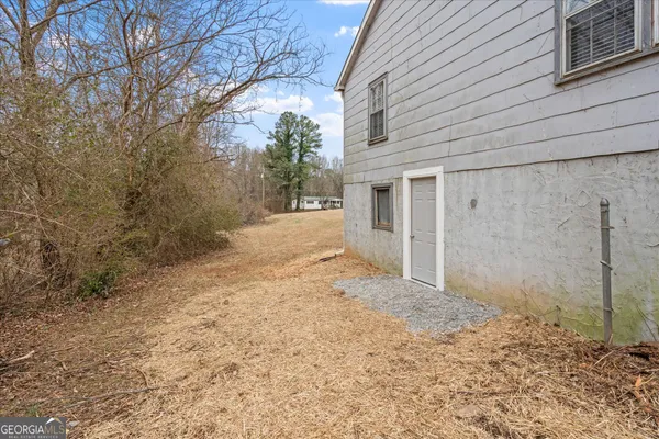 a view of a backyard of a house
