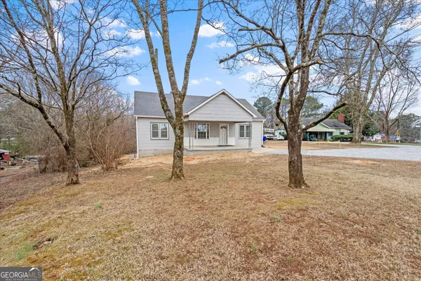 a house with trees in front of it