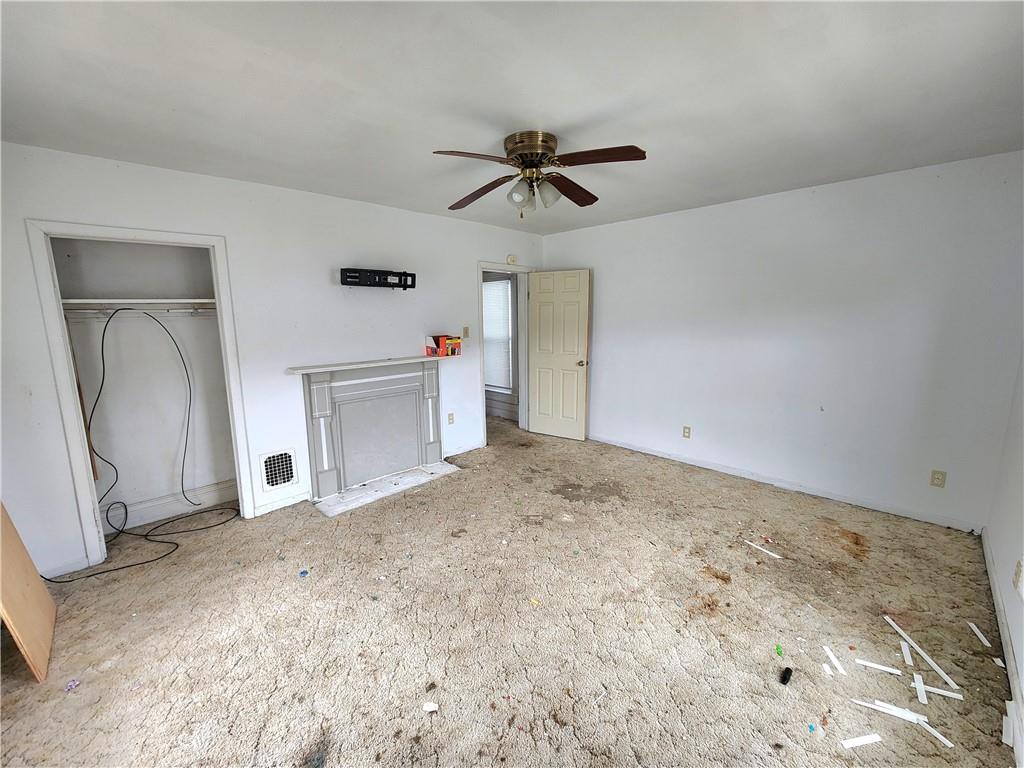 26 West Terrace Avenue New Castle, PA 16102 - Photo 12 of 12 a view of a livingroom with wooden floor and a ceiling fan