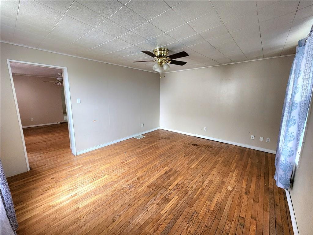 26 West Terrace Avenue New Castle, PA 16102 - Photo 5 of 12 wooden floor in an empty room with a window