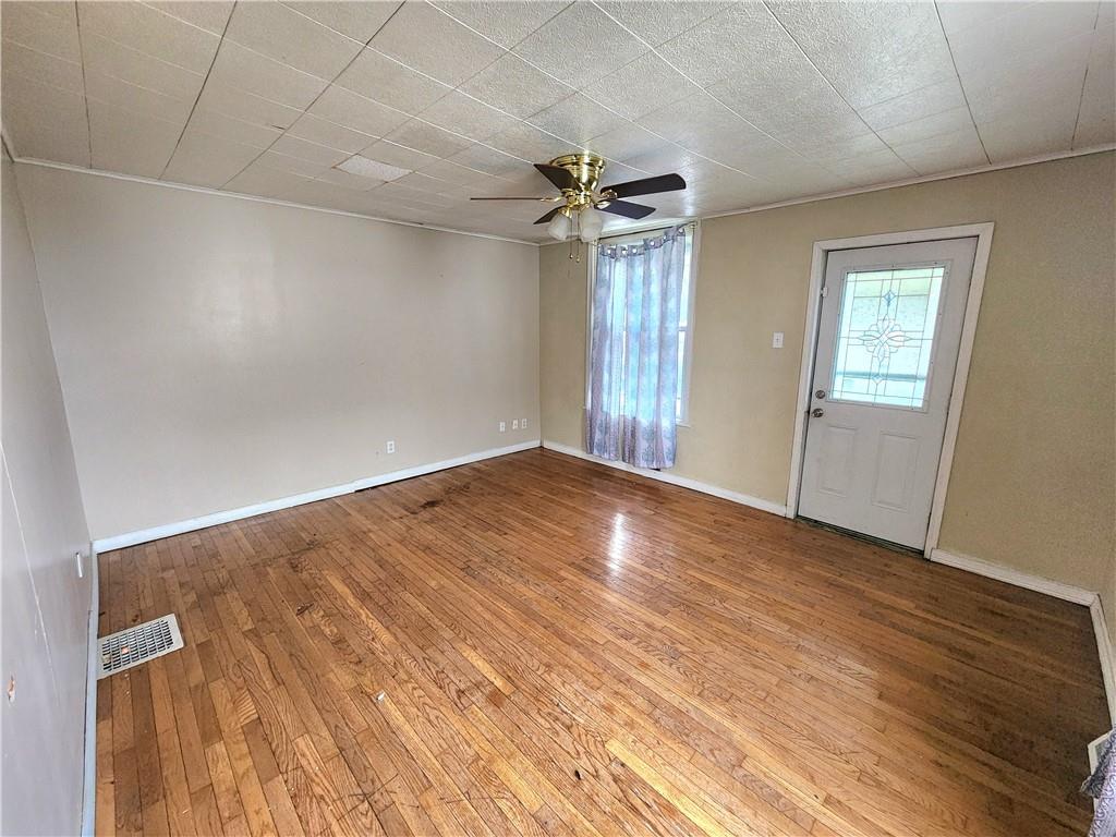 26 West Terrace Avenue New Castle, PA 16102 - Photo 6 of 12 wooden floor in an empty room with a window