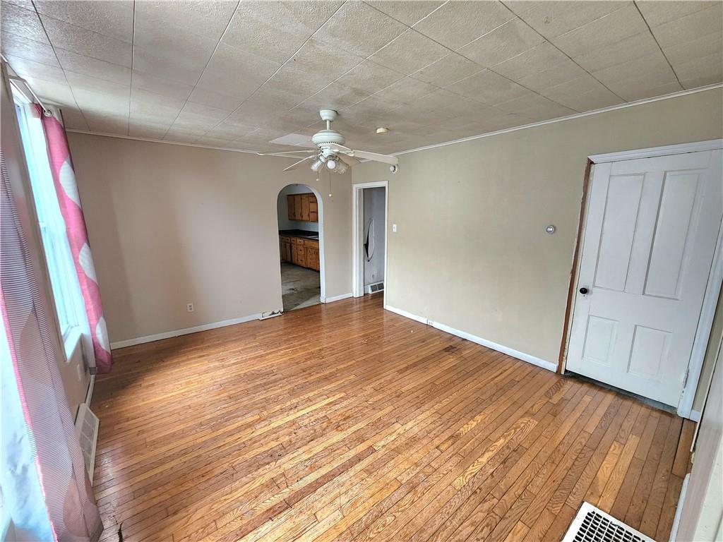 26 West Terrace Avenue New Castle, PA 16102 - Photo 7 of 12 a view of empty room with wooden floor and fan