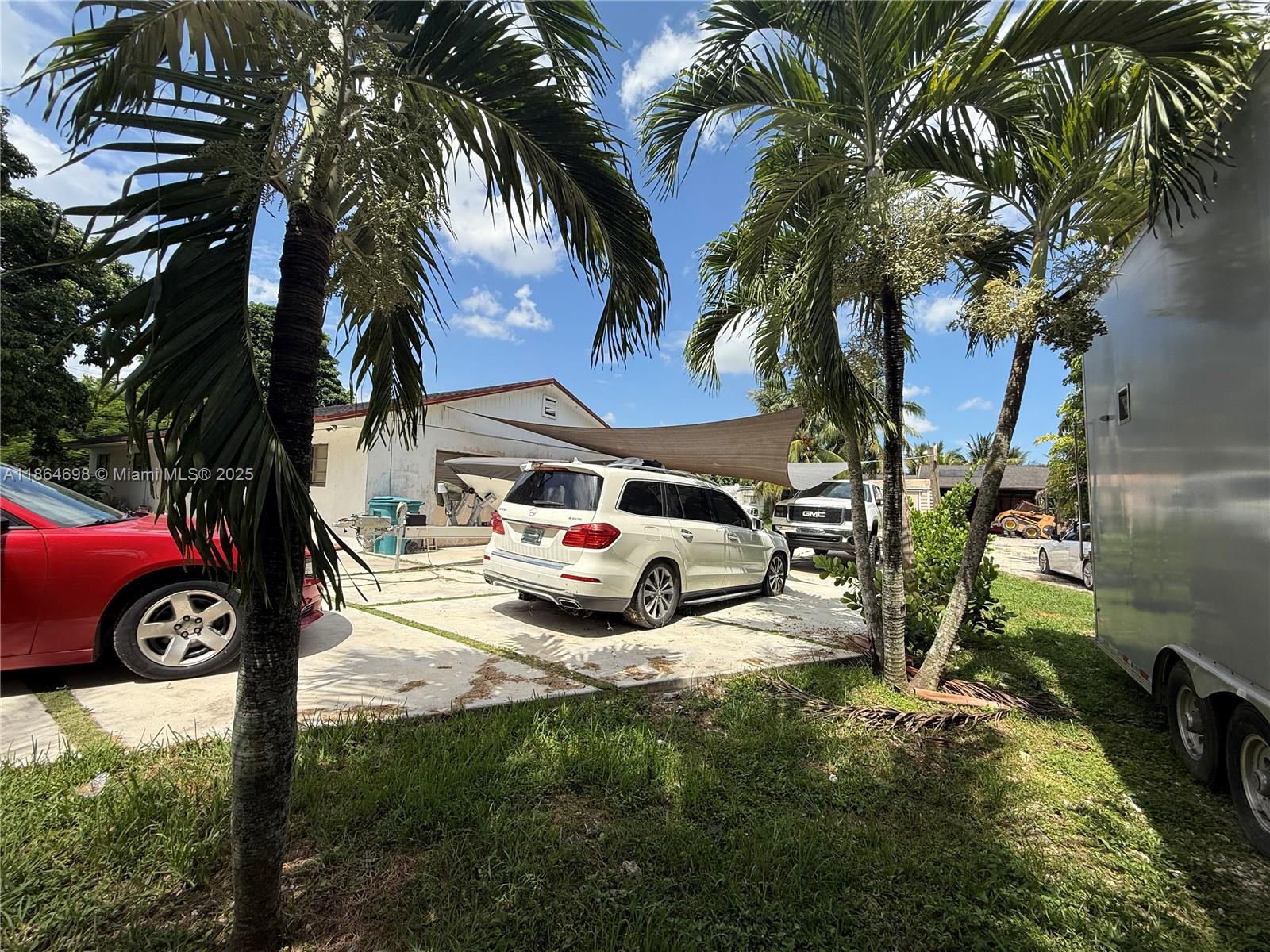 15765 Southwest 206th Avenue Miami, FL 33187 - Photo 12 of 57 a view of backyard with car parked