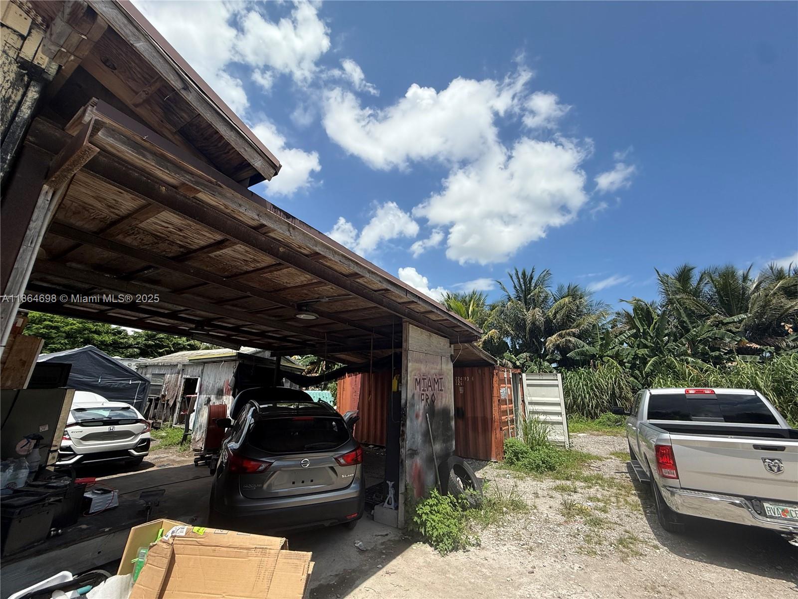 15765 Southwest 206th Avenue Miami, FL 33187 - Photo 24 of 57 a view of car parked in garage