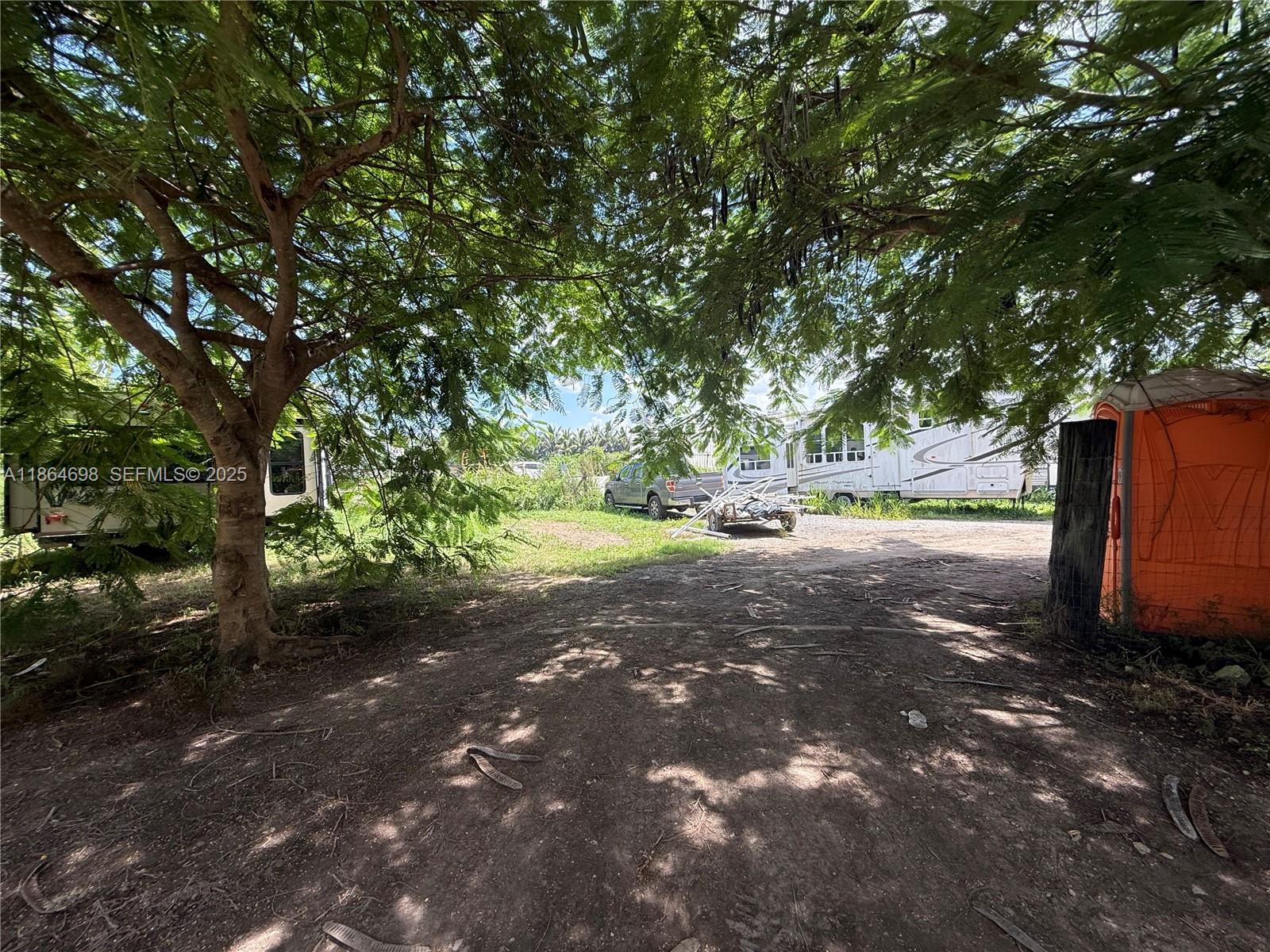 15765 Southwest 206th Avenue Miami, FL 33187 - Photo 29 of 57 a view of a yard with large trees