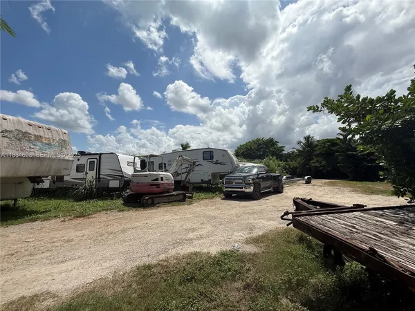 a view of a backyard with sitting area