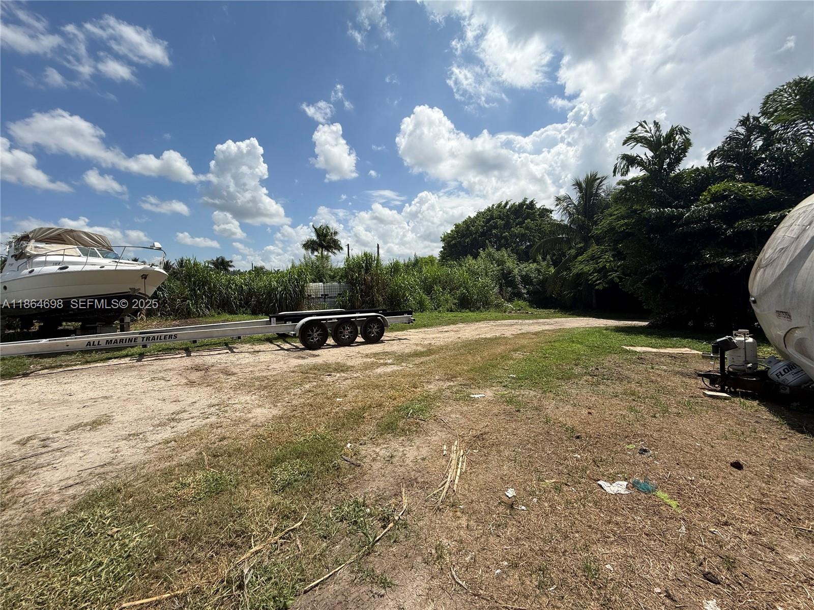 15765 Southwest 206th Avenue Miami, FL 33187 - Photo 35 of 57 a view of a backyard with sitting area