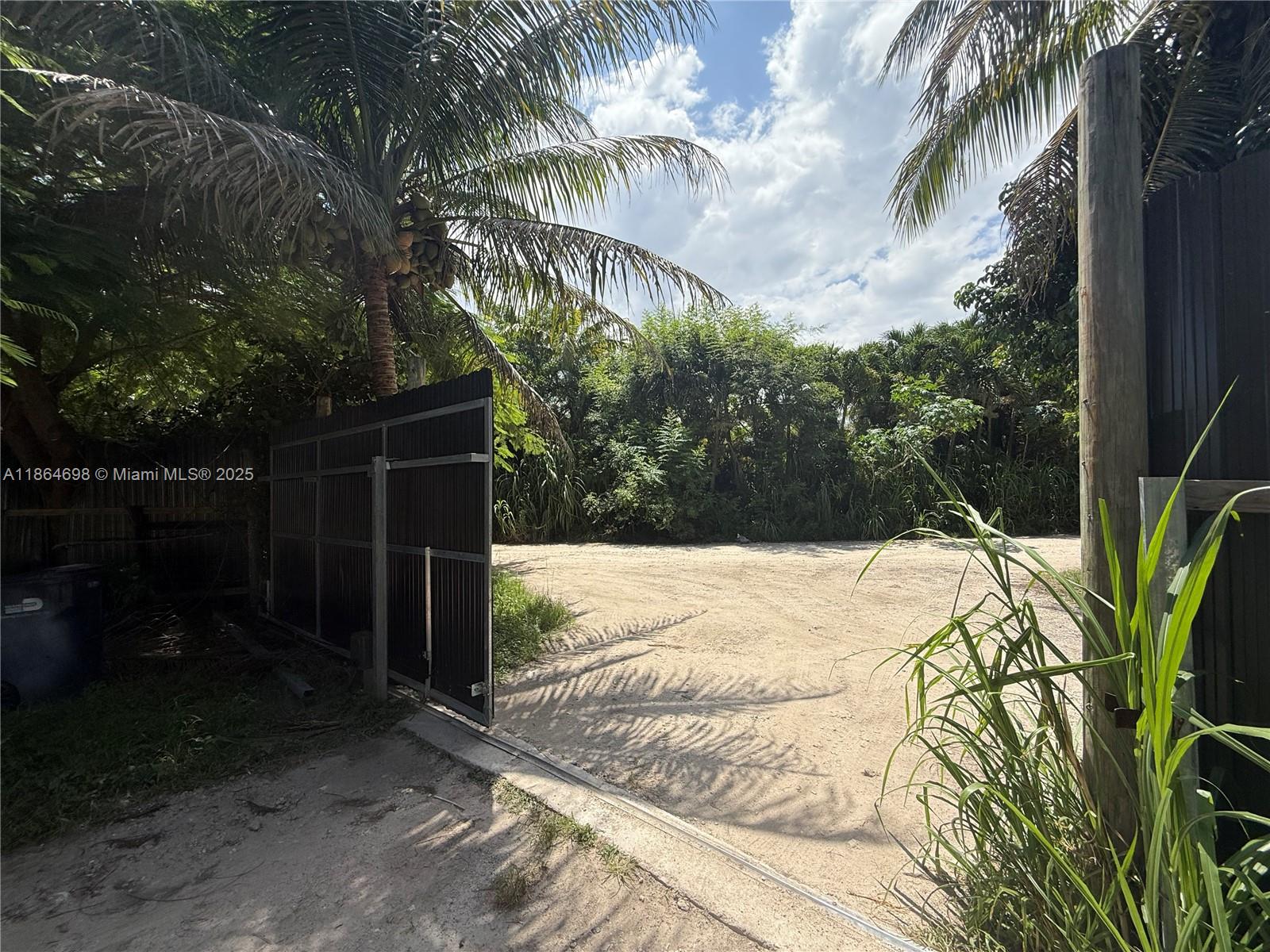 15765 Southwest 206th Avenue Miami, FL 33187 - Photo 39 of 57 a view of a backyard of the house