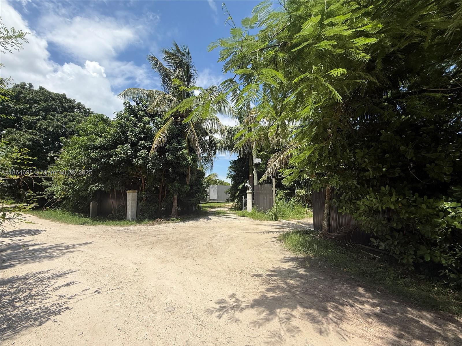 15765 Southwest 206th Avenue Miami, FL 33187 - Photo 40 of 57 a street view with large trees