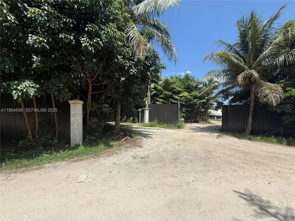 a view of a kitchen area with furniture and wooden floor