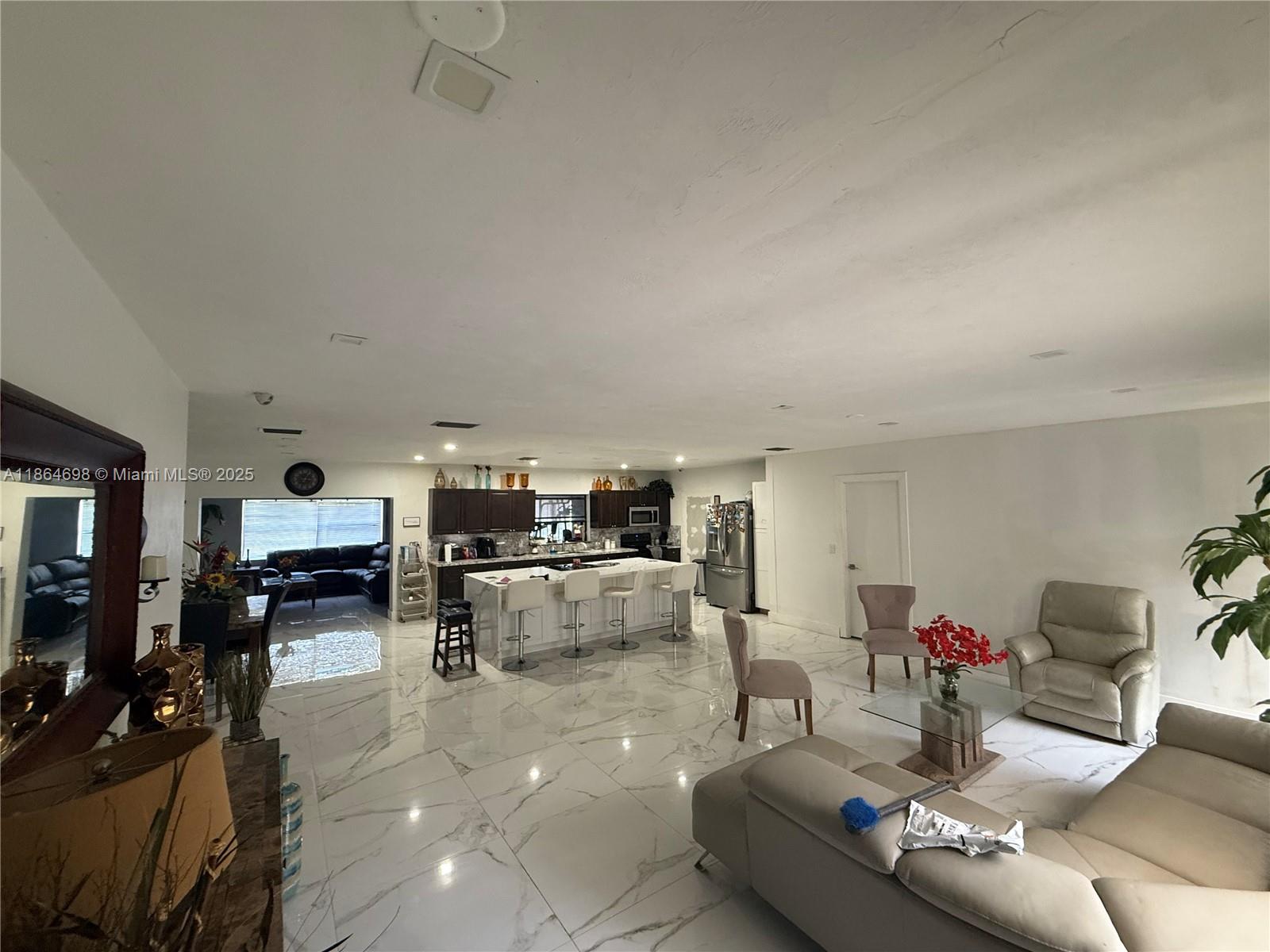 15765 Southwest 206th Avenue Miami, FL 33187 - Photo 45 of 57 a living room with furniture and a couch