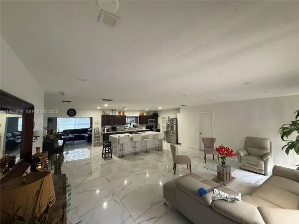 a bedroom with two beds and a lamp