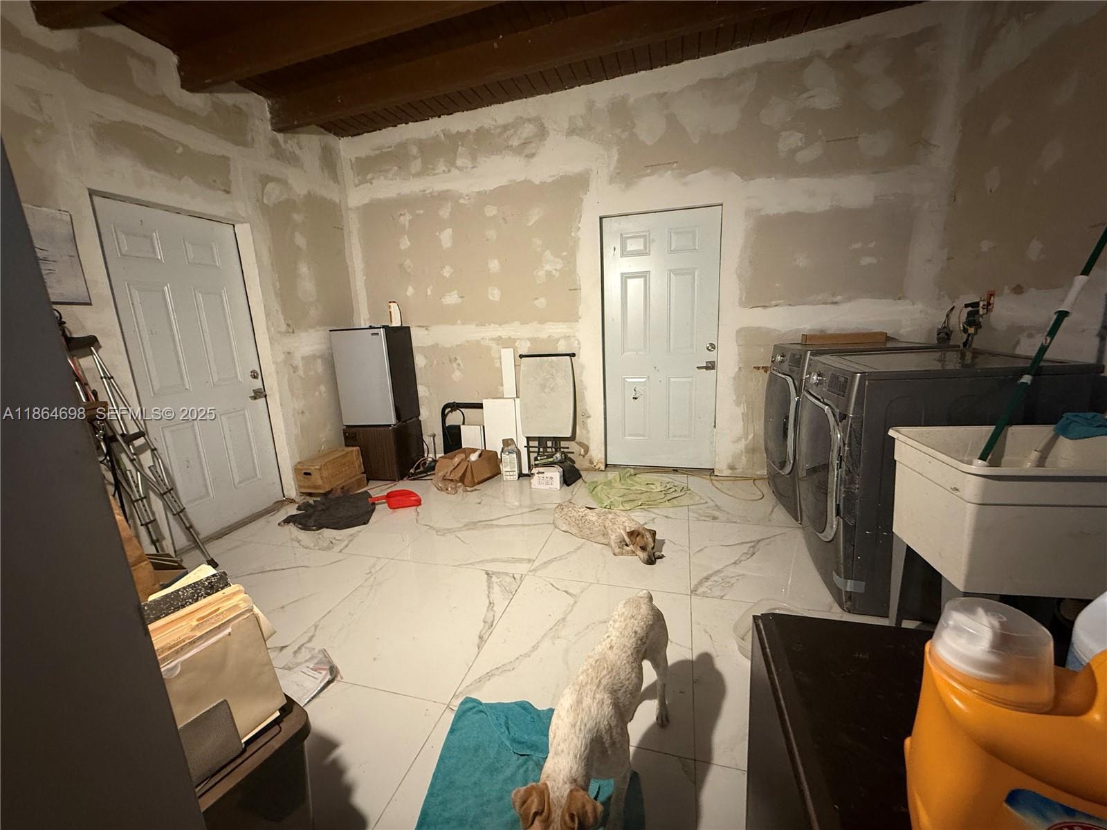 15765 Southwest 206th Avenue Miami, FL 33187 - Photo 47 of 57 a view of a kitchen area with furniture and wooden floor