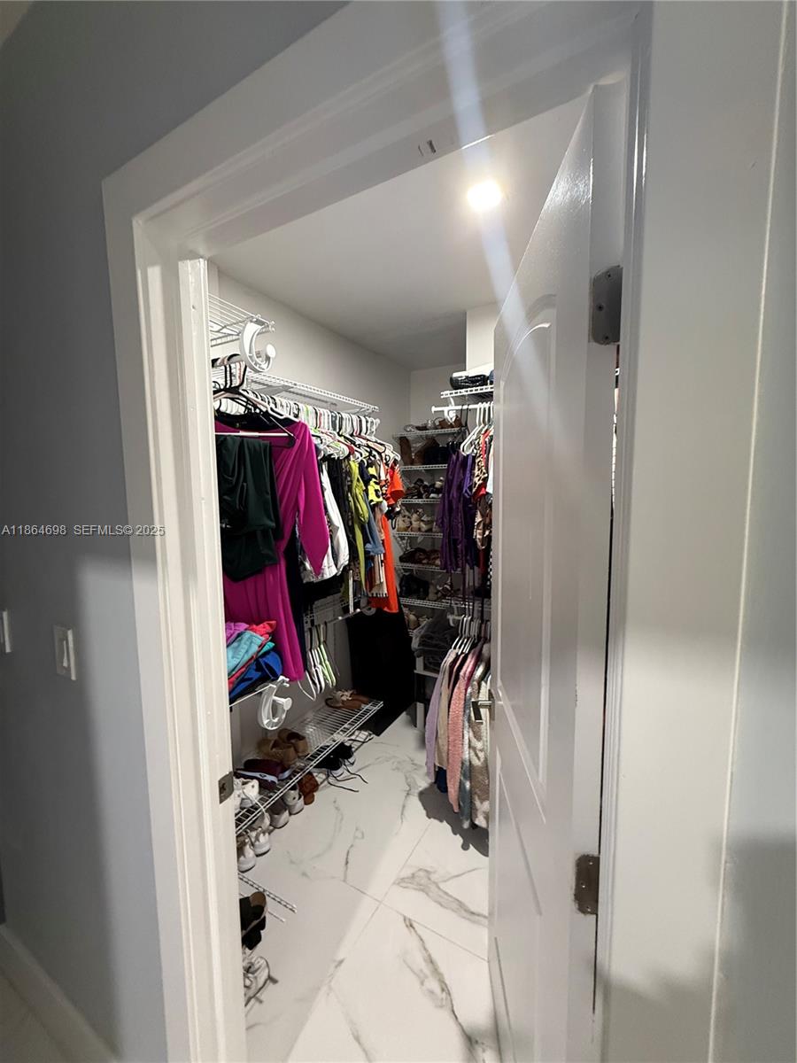 15765 Southwest 206th Avenue Miami, FL 33187 - Photo 51 of 57 a view of a closet with storage